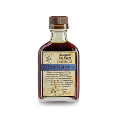 Bluegrass soy sauce bottle, dark brown liquid, ribbed metal cap, front label