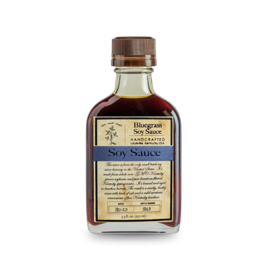 Bluegrass soy sauce bottle, dark brown liquid, ribbed metal cap, front label