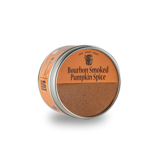 Smoked pumpkin spice tin with orange lid label and brown ground spice inside