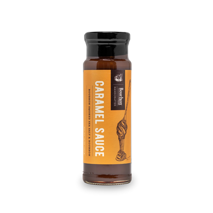 Caramel sauce bottle with orange label and dark cap