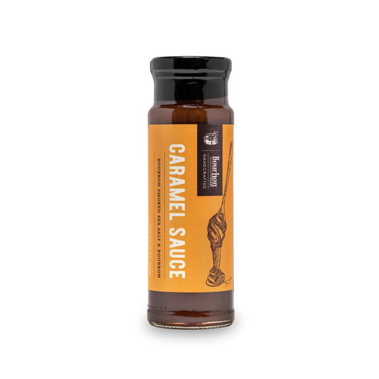 Caramel sauce bottle with orange label and dark cap