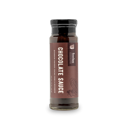 Bourbon-smoked cacao nib chocolate sauce bottle with dark amber liquid