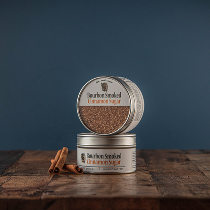 Bourbon smoked cinnamon sugar open tin with closed tin on wood, brown granules