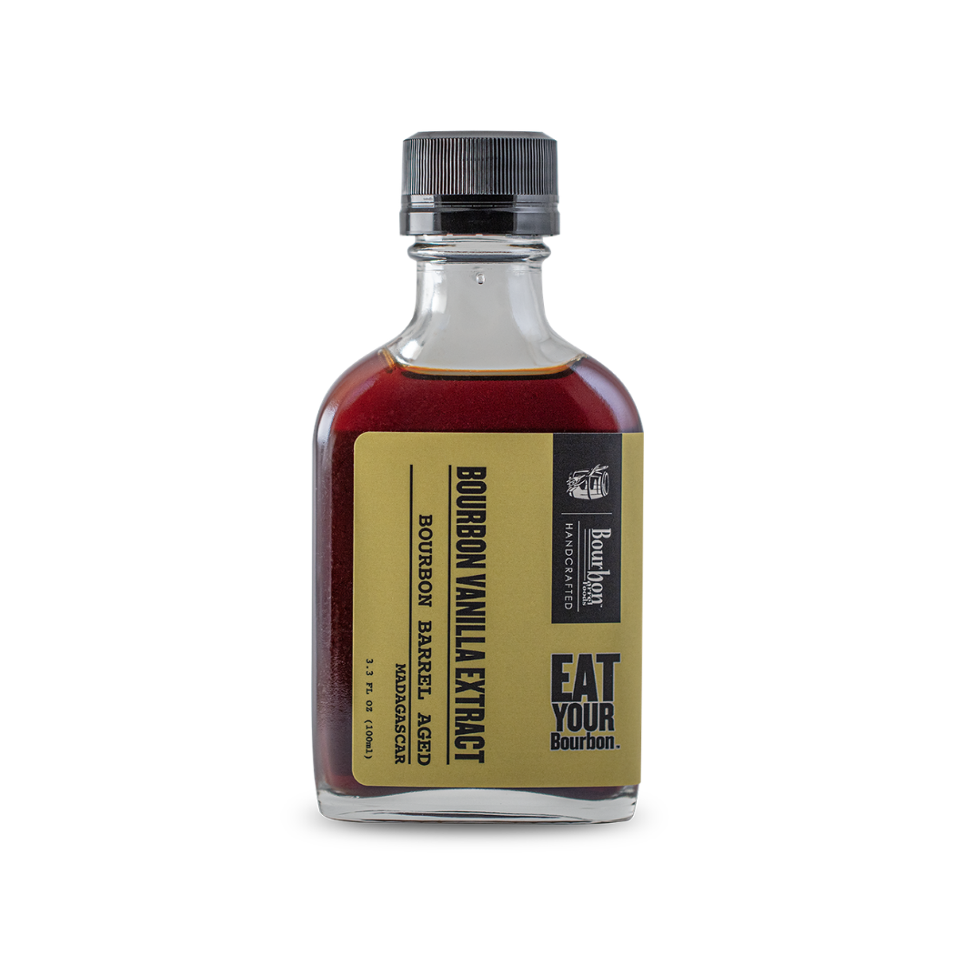 Bourbon-barrel aged vanilla extract bottle, amber liquid, black cap