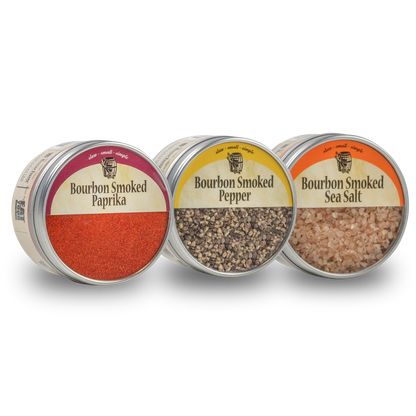 Three spice jars: bourbon smoked paprika, smoked pepper, and bourbon smoked sea salt