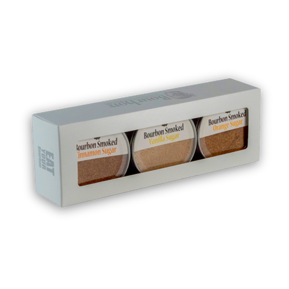 Bourbon smoked sugars gift box with three labeled jars: cinnamon, vanilla, orange