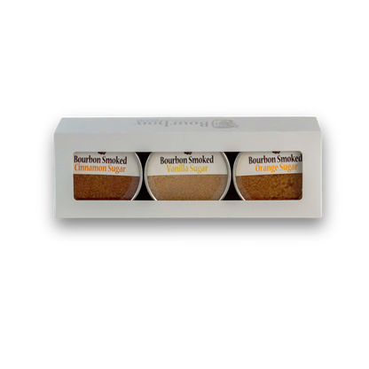 Bourbon smoked sugars gift box showing jars labeled cinnamon, vanilla sugar, and orange