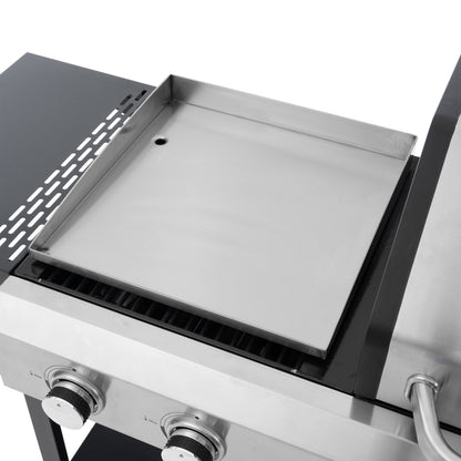 Silver griddle plate inside open gas grill body with vented side panel