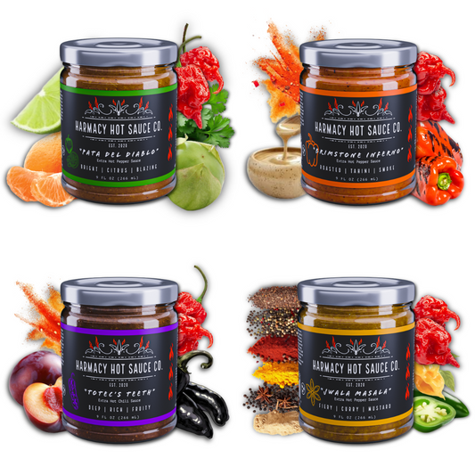 Variety hot sauce set with four jars and chili peppers, multiple labels