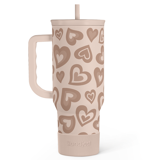 Heart-patterned 40oz slider tumbler with handle, tan with beige hearts, straw up