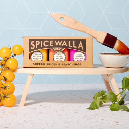 BBQ rub trio box with flavor labels and wooden spatula