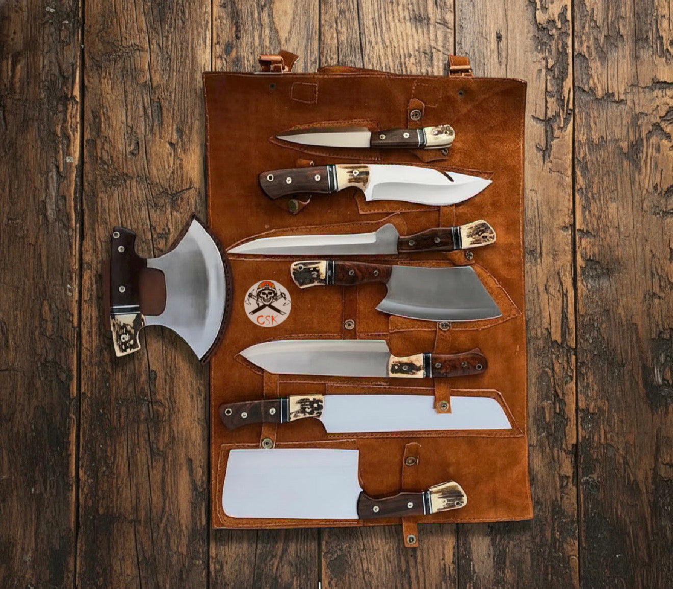 8-piece outdoor knife set with leather roll; chef and hunting knives laid out