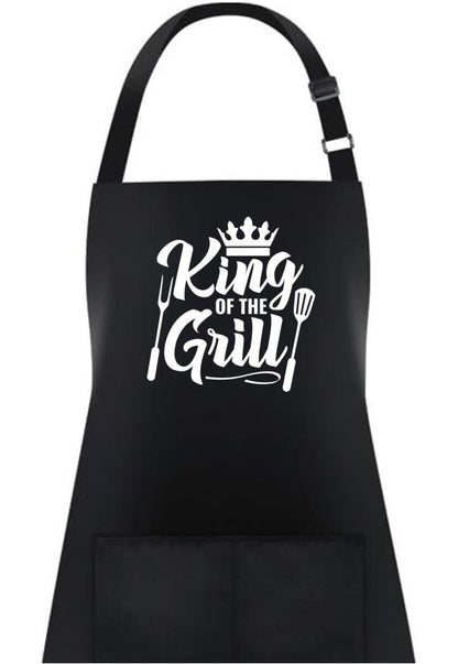 Black BBQ apron with white “King of the Grill” logo and hanging strap