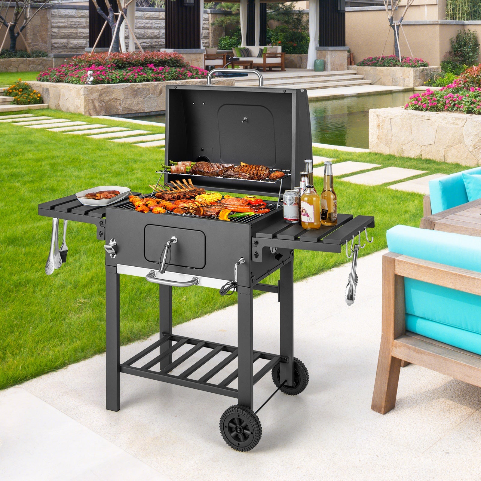 Outdoor charcoal grill on wheels with open cooking hood and foldable side shelves