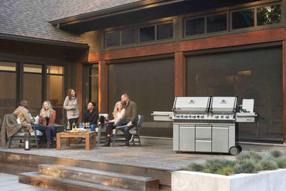 Outdoor stainless steel gas grill with dual hoods, side shelf, and caster wheels