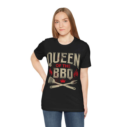 Black T-shirt on model with "Queen of the BBQ" chest graphic, flames, and tools