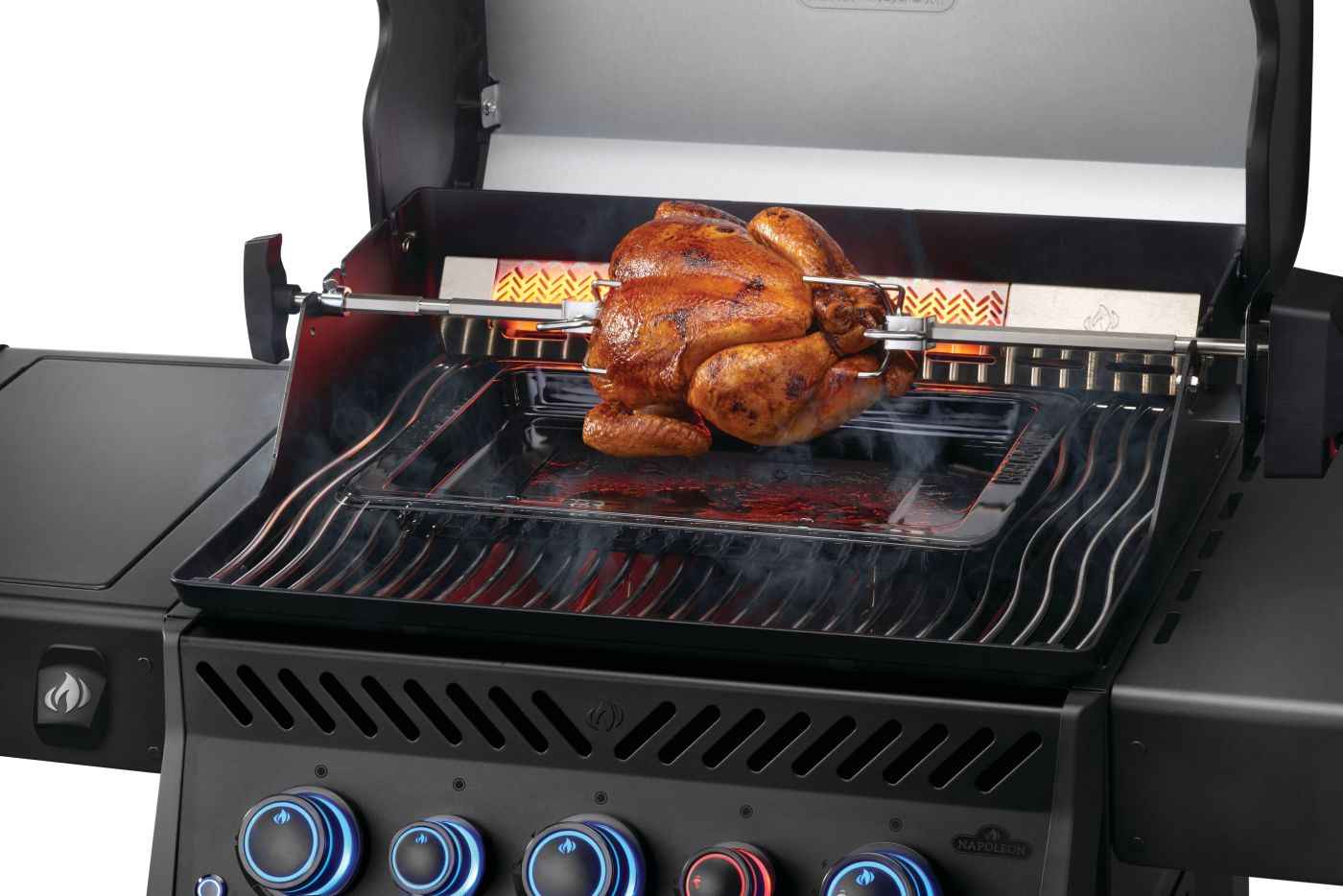 Black gas grill with rotisserie chicken on cooking grates, blue control knobs