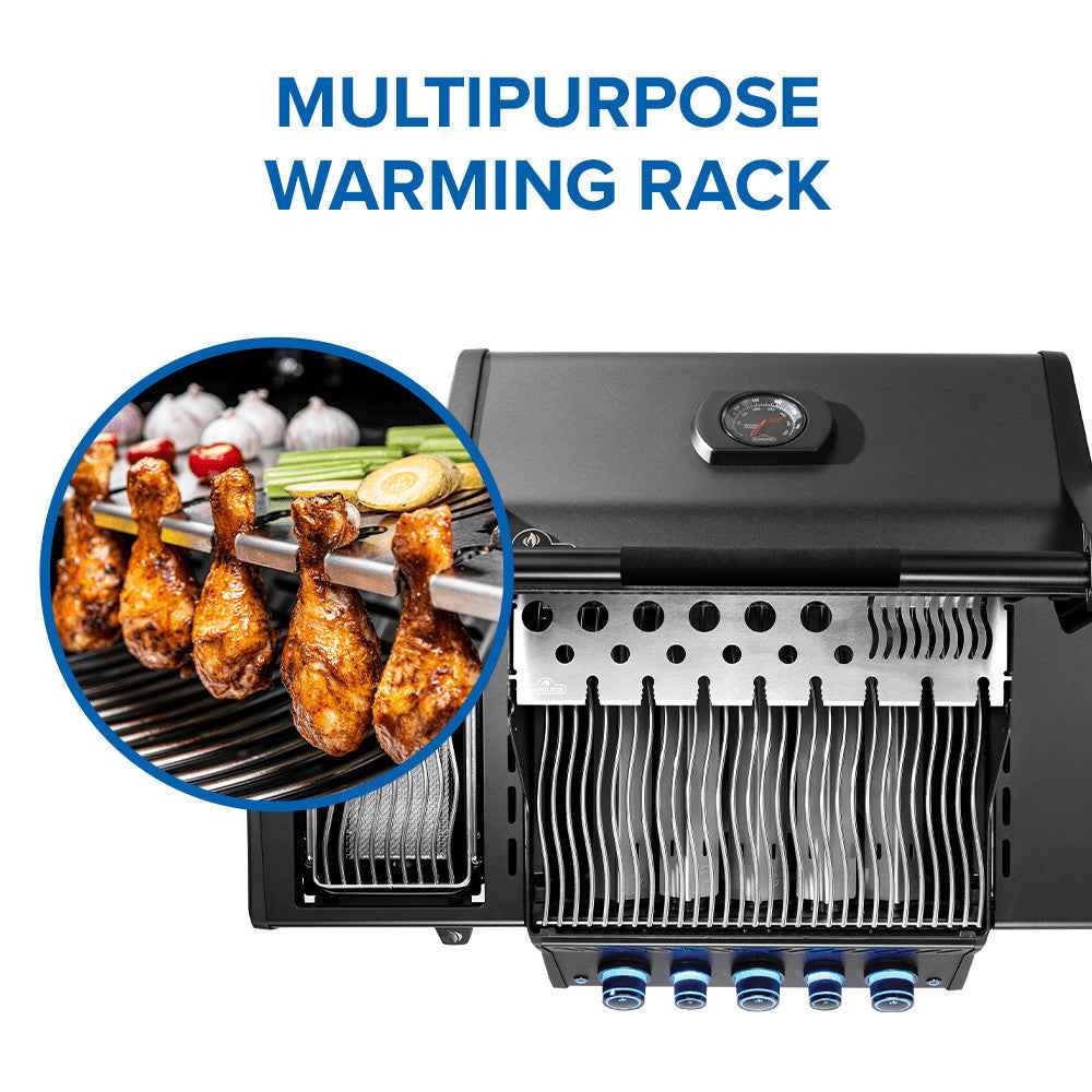 Black gas grill with warming rack above the cooking grates and blue control knobs