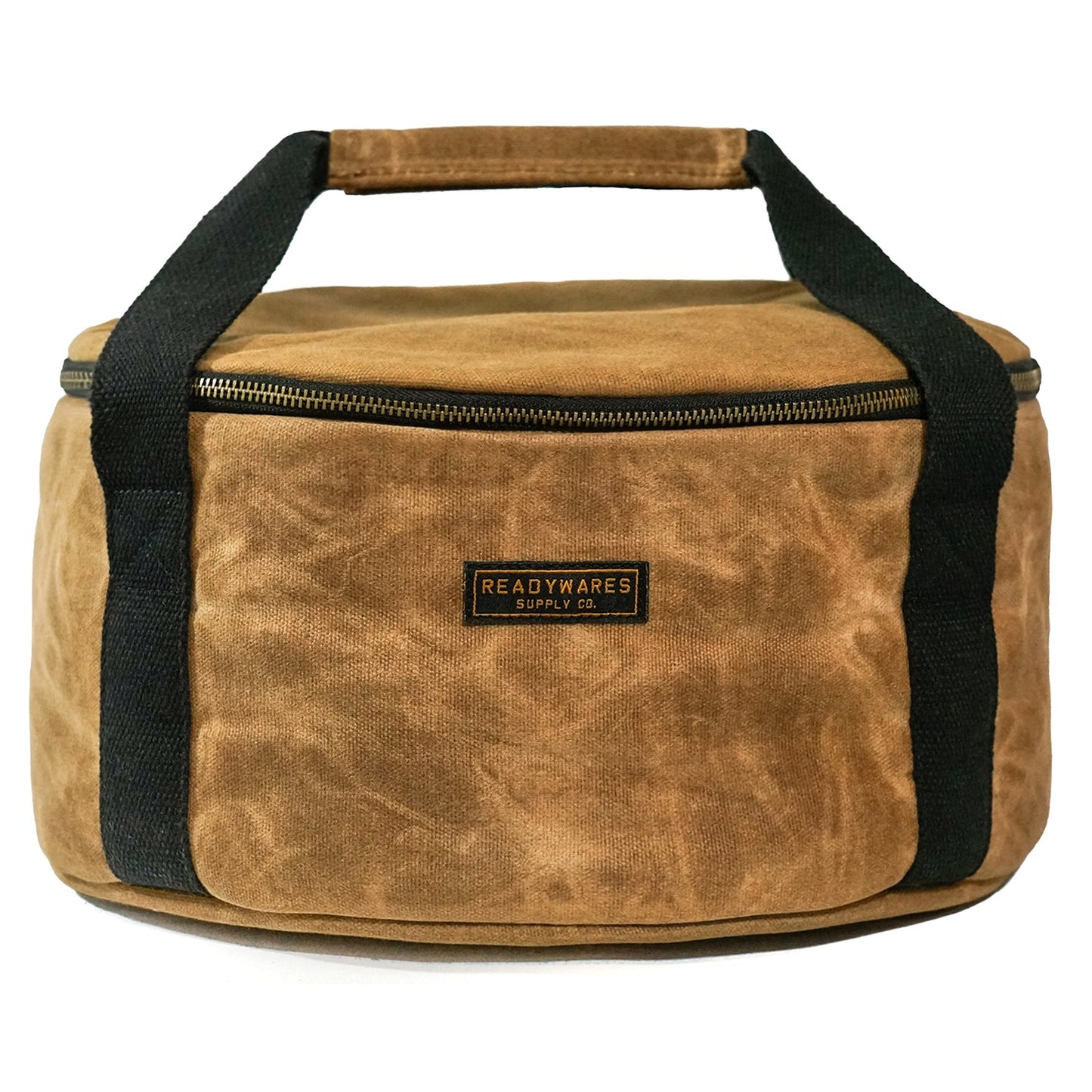 Insulated Dutch oven cover with tan fabric, black handles, and top zip closure