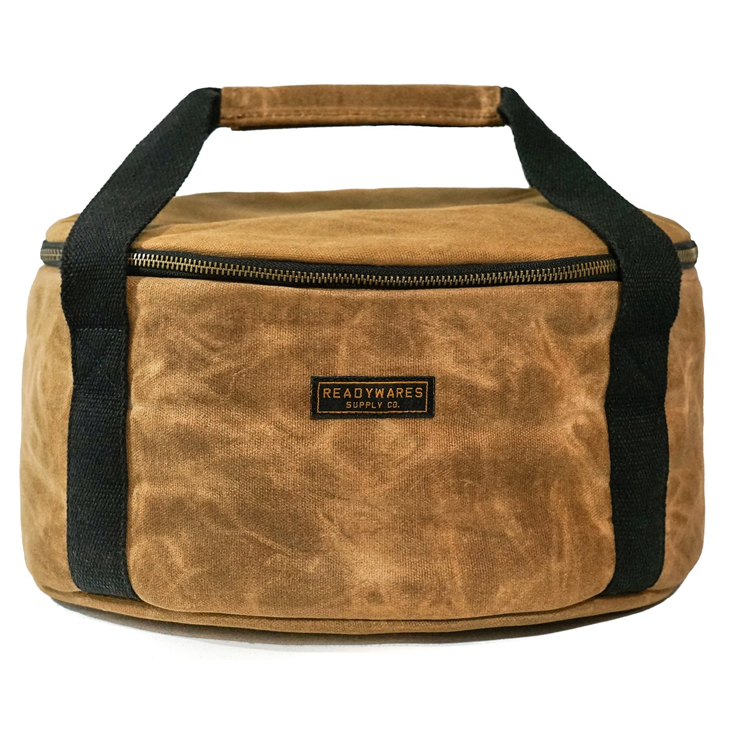 Insulated Dutch oven cover with tan fabric, black handles, and top zip closure
