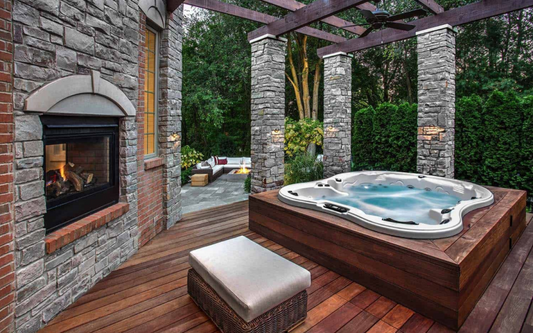 Outdoor dark-wood hot tub with white shell and spa jets, shown on wooden deck