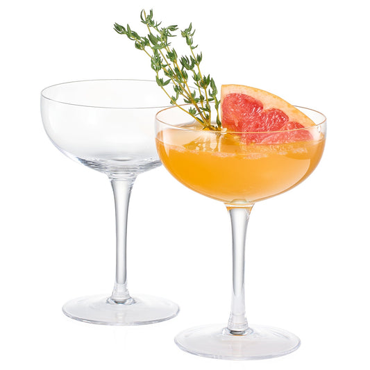Champagne coupe cocktail glasses, clear set of 2, with orange drink and garnish