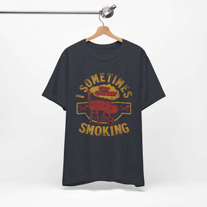 Graphic T-shirt in dark heather gray on a hanger, with front BBQ text graphic.