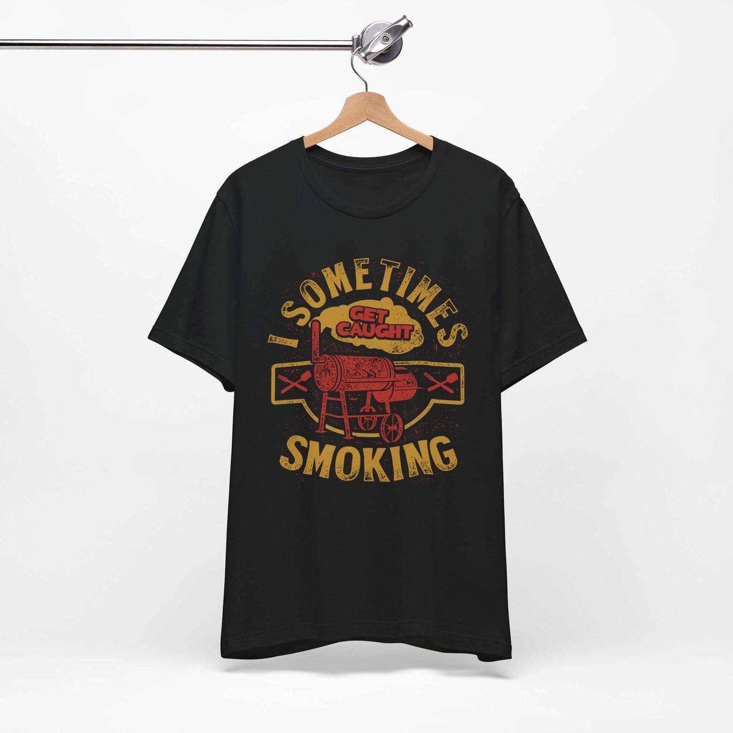 Graphic T-shirt in black on a hanger, with front BBQ text graphic.