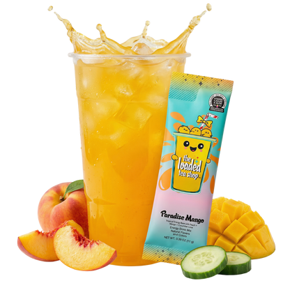 Mango loaded tea in tall yellow cup with mango and cucumber slices
