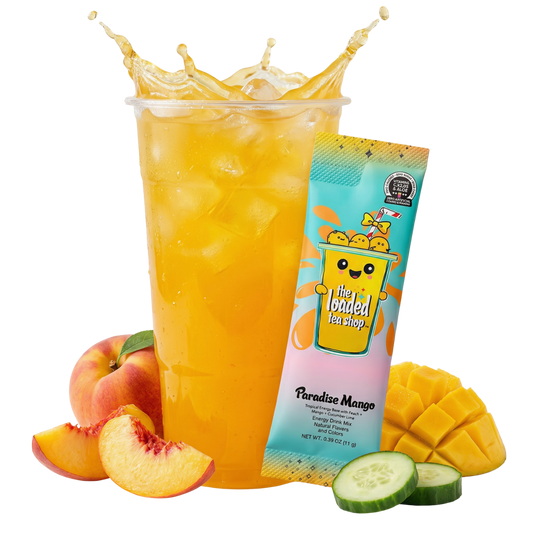 Mango loaded tea in tall yellow cup with mango and cucumber slices