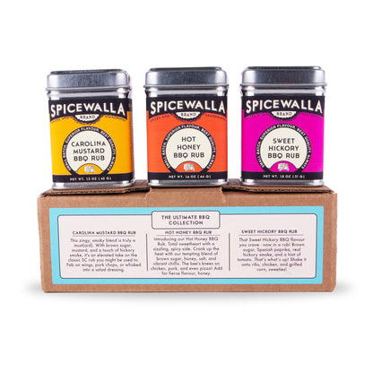 Three BBQ rub tins on carton: Carolina mustard, hot honey, sweet hickory