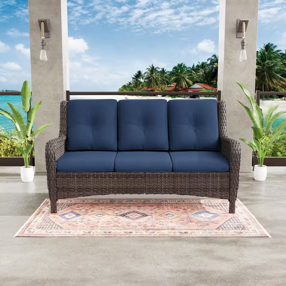 3-seat wicker sofa with dark blue cushions and two-tone woven frame