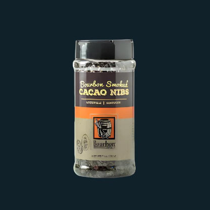 Cacao nibs jar with clear lid, transparent body, orange label band and gold text