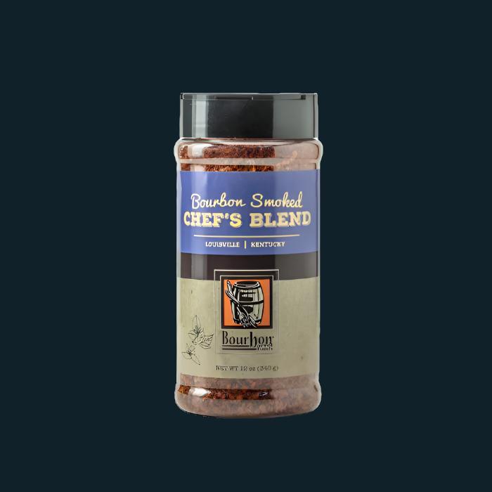 Spice blend jar with clear lid, blue label, and red-orange granules visible