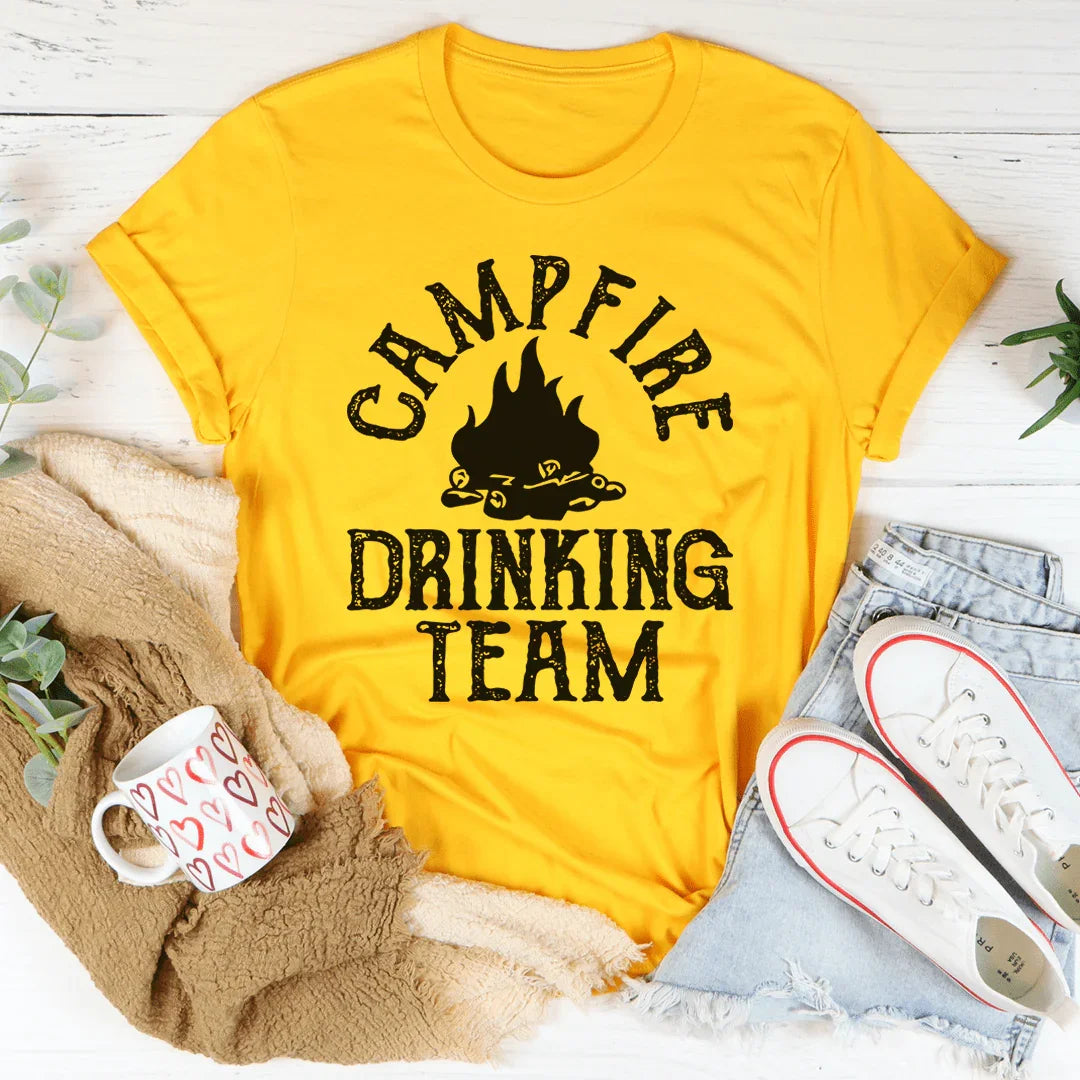Mustard yellow crewneck graphic tee with black campfire icon and 'Campfire Drinking Team' text