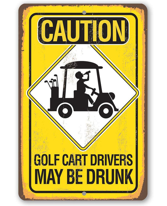 Rectangular metal caution sign with yellow header, golf cart icon, and 'MAY BE DRUNK' text
