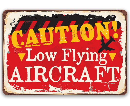 Red and yellow caution metal aircraft sign with black background and distressed border.