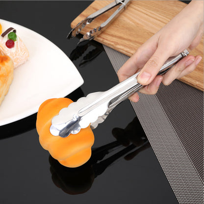Stainless steel BBQ steak tongs with orange silicone grip and scalloped jaws