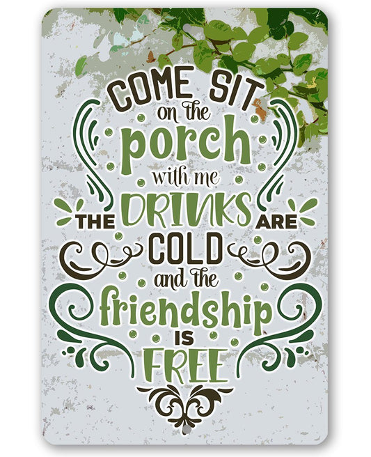 Green and white metal porch sign: drinks are cold, friendship is free
