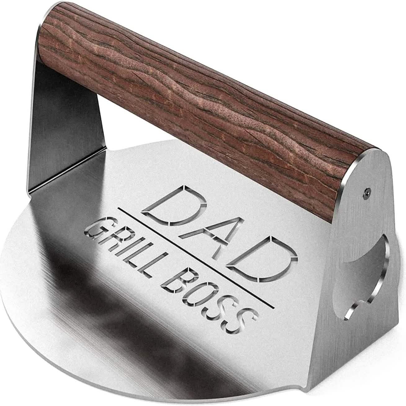 Stainless steel smash burger press with dark wood handle and side bottle opener