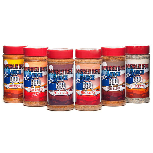 BBQ spice rub collection with six condiment jars, red lids and colorful labels