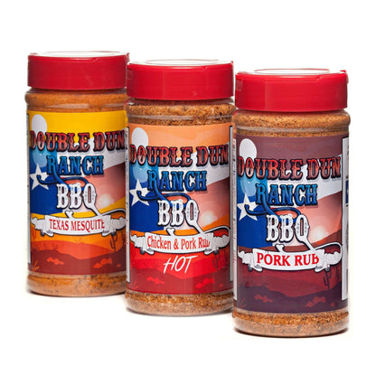 BBQ rub seasoning bottles in red caps: Texas Mesquite, Hot, Pork Rub
