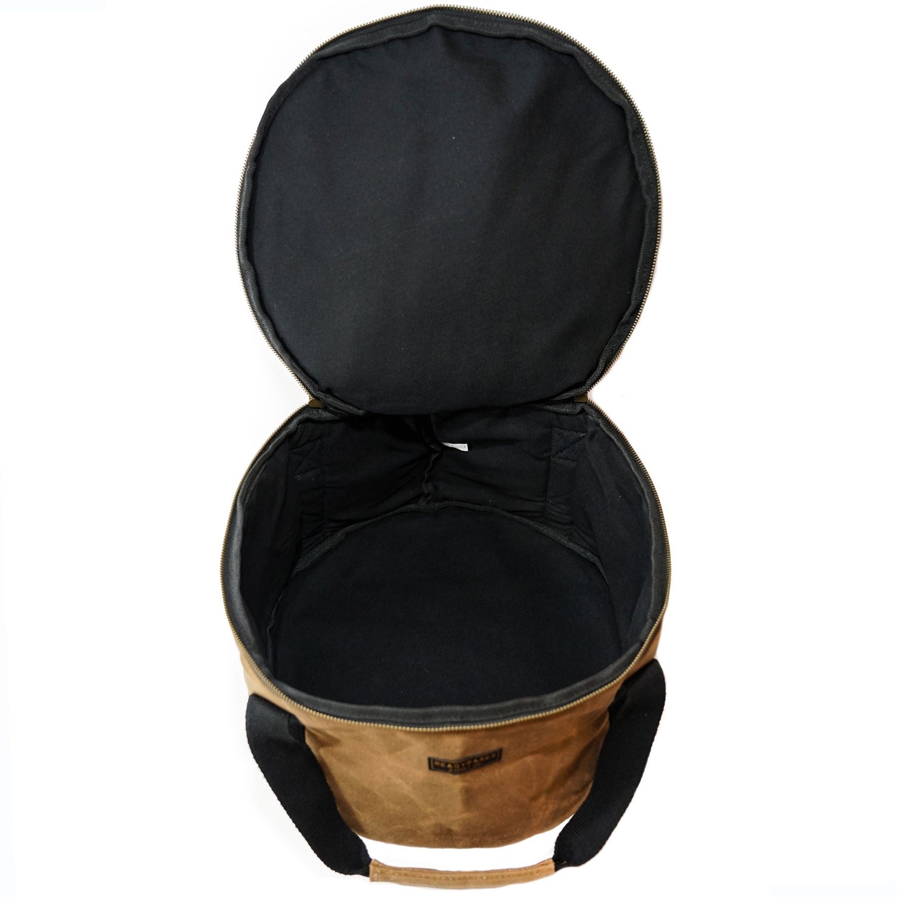 Dutch oven cover with open lid and black interior lining, tan outer fabric, zip