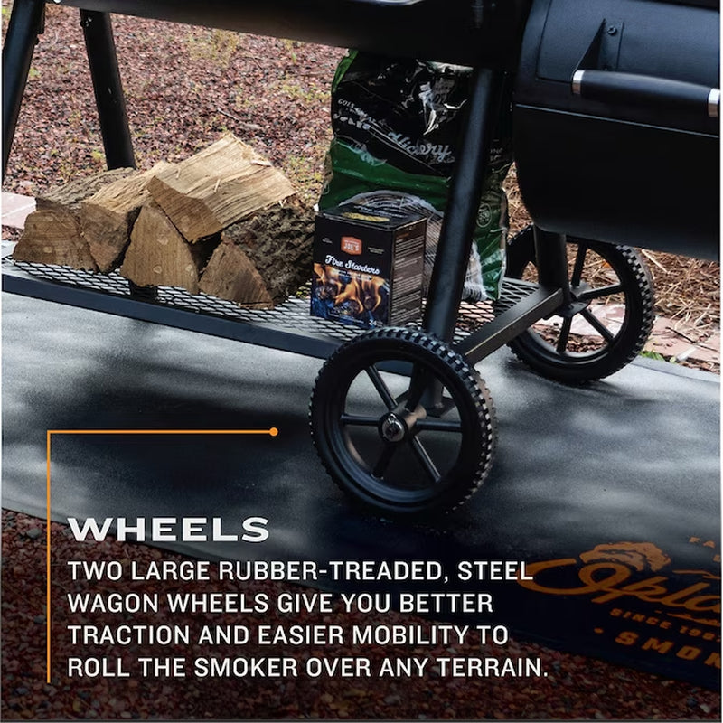 Offset barrel smoker with two large rubber-tread steel wagon wheels