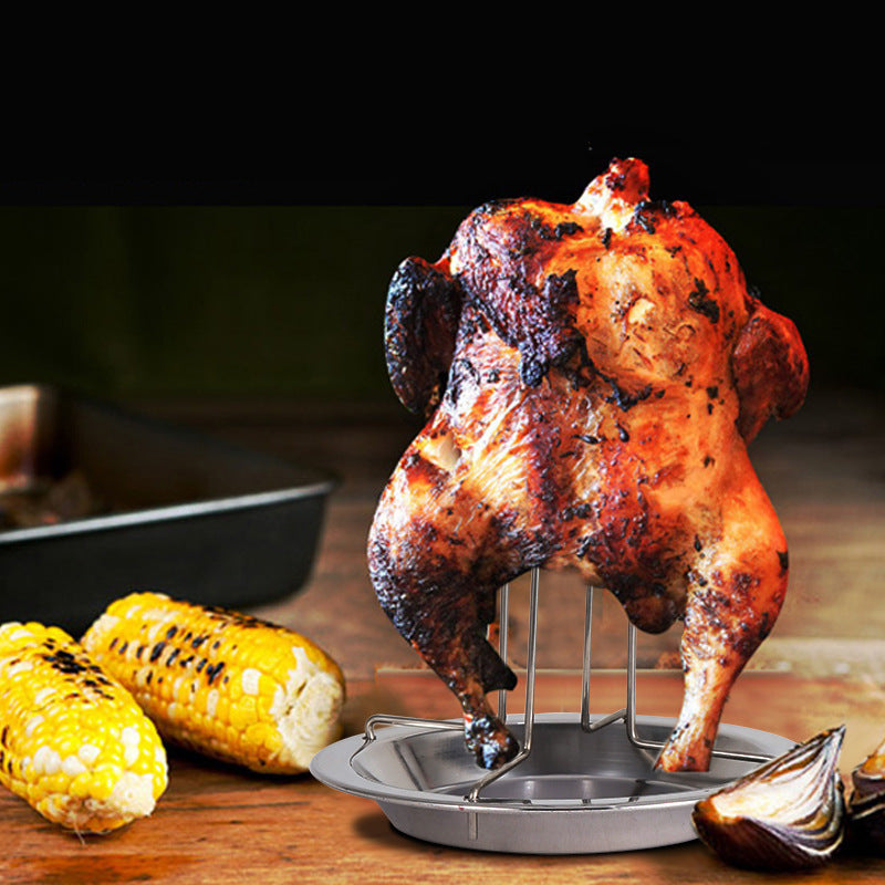 Chicken roaster tray with rack holding a browned roasted chicken