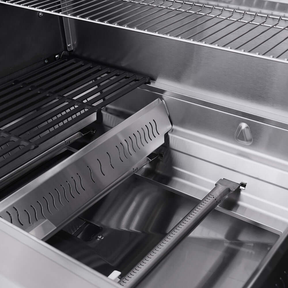 Stainless gas grill interior with cooking grates and drip tray, lid open