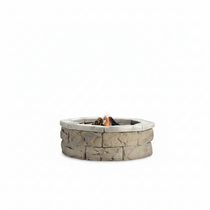 Limestone stone fire pit kit with circular rim and burning fire in center
