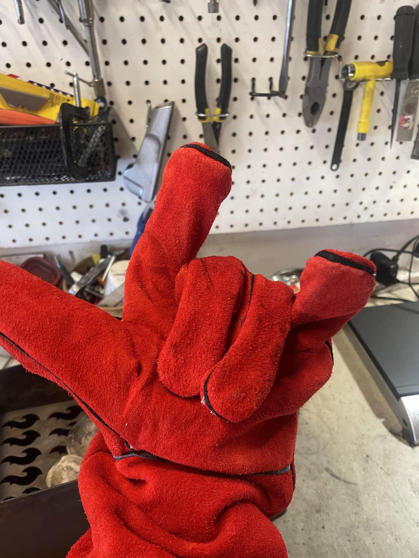 Red insulated campfire glove with thick cuff for handling hot grill parts