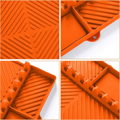 Orange silicone mat surface with raised ridges and molded slots for tools