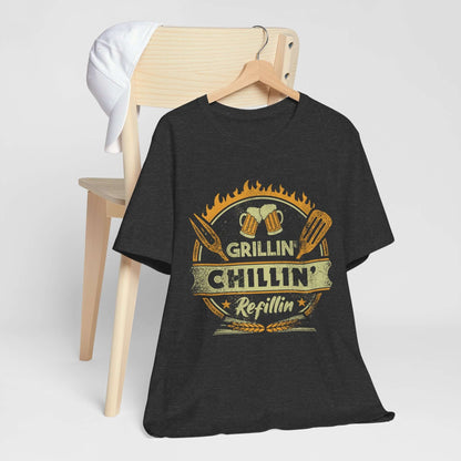 Dark grey heather graphic BBQ T-shirt with grill and chillin’ refillin’ emblem on hanger